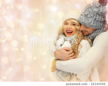 happy family couple in winter clothes hugging 26145449