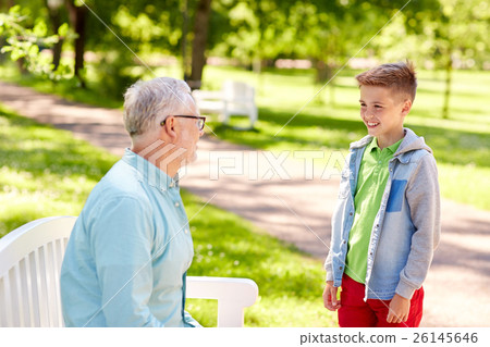 grandfather and grandson talking at summer park 26145646