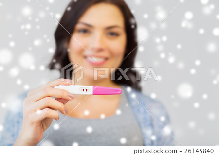 happy woman with home pregnancy test happy woman with home pregnancy test 26145840