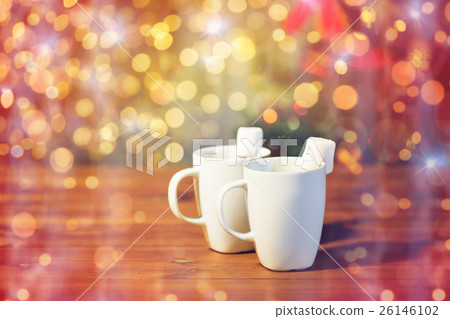 cups of hot chocolate with marshmallow on wood 26146102