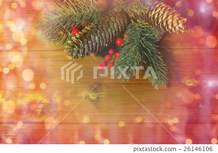 close up of fir branch with cones on wooden table close up of fir branch with cones on wooden table 26146106