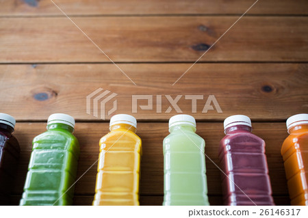 bottles with different fruit or vegetable juices bottles with different fruit or vegetable juices 26146317