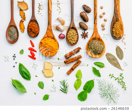 Various herbs and spices in wooden spoons. 26146639