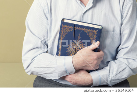Hands holding the Koran Hands holding the Koran 26149104