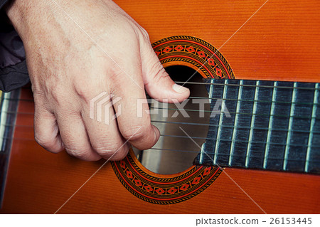 closeup playing the guitar vintage effect. closeup playing the guitar vintage effect. 26153445