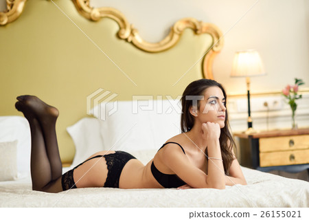 Sexy young woman in lingerie posing on the bed Sexy young woman in lingerie posing on the bed 26155021