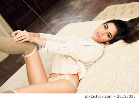 Sexy young woman in lingerie posing on the bed 26155023