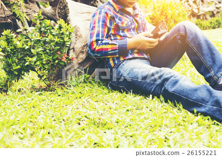 Child with mobile phone in his hand,Or child asian Child with mobile phone in his hand,Or child asian 26155221