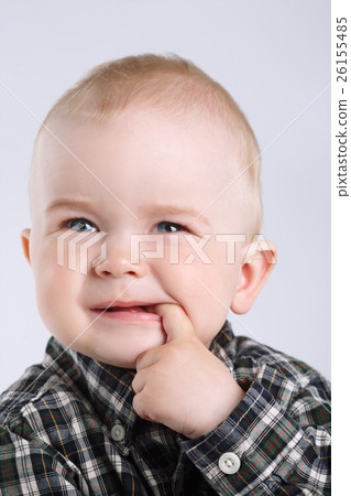 little boy with finger in mouth little boy with finger in mouth 26155485