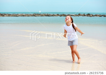 little girl have fun on the beach little girl have fun on the beach 26155736