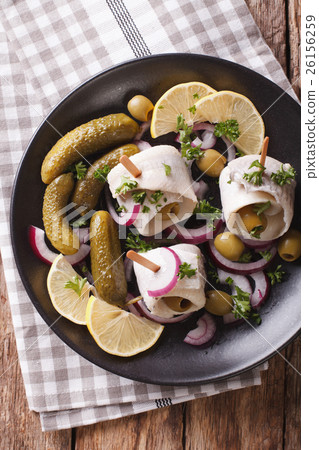 Tasty rollmops stuffed olives, onions, pickles Tasty rollmops stuffed olives, onions, pickles 26156259