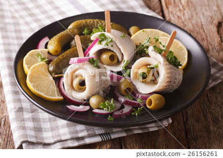 Tasty rollmops stuffed olives, onions, pickles Tasty rollmops stuffed olives, onions, pickles 26156261