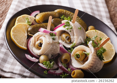 rolls of marinated herring with olives, onions rolls of marinated herring with olives, onions 26156262