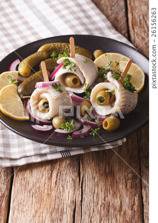 rolls of marinated herring with olives, onions rolls of marinated herring with olives, onions 26156263