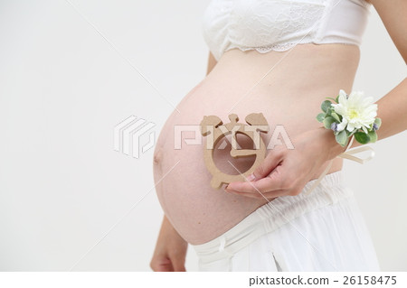 Pregnant woman with watch Pregnant woman with watch 26158475