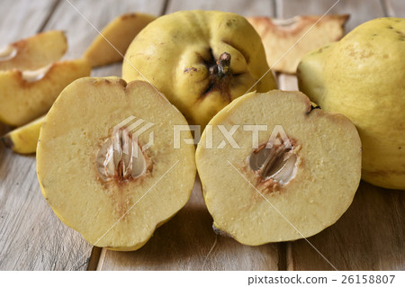 quince fruits on a wooden table 26158807