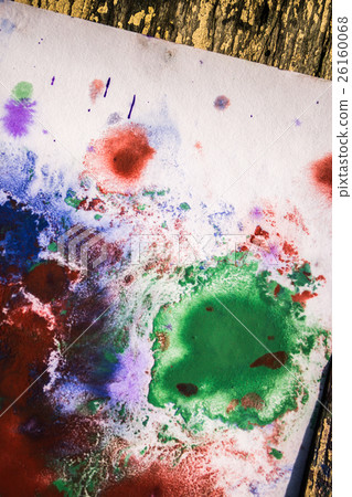 green red blue blots white paper lying on a woode green red blue blots white paper lying on a woode 26160068