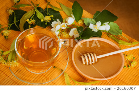 Cup of tea linden jasmine honey wooden background 26160307