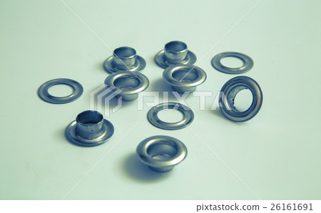 Hole rivets on a light background retro optics 26161691