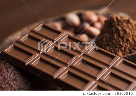 Cocoa pod and chocolate bar and food dessert  26162810