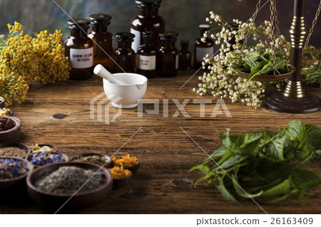 Fresh medicinal, healing herbs on wooden 26163409