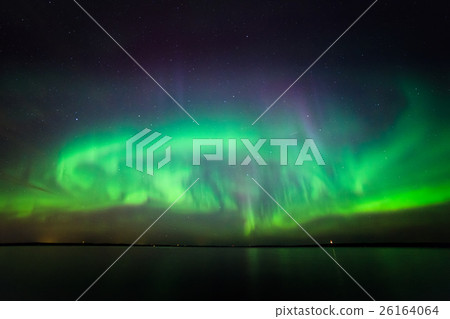 Northern lights over lake in finland 26164064