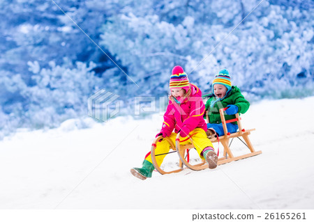 Kids having fun on sleigh ride Kids having fun on sleigh ride 26165261