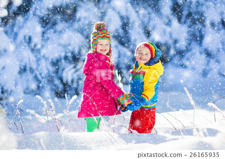 Children playing in snowy winter park Children playing in snowy winter park 26165935