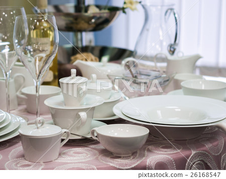 Set of dishes on table 26168547