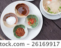 Seasoning for Thai rice soup on wood table 26169917