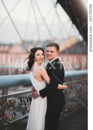 Gorgeous wedding couple, bride and groom posing on 26170206