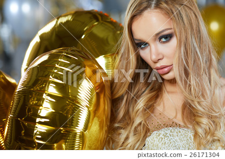 portrait of blond young woman between golden portrait of blond young woman between golden 26171304