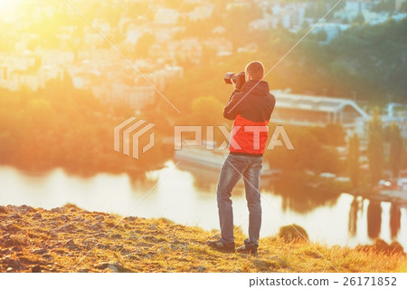 Photographer at the sunrise Photographer at the sunrise 26171852