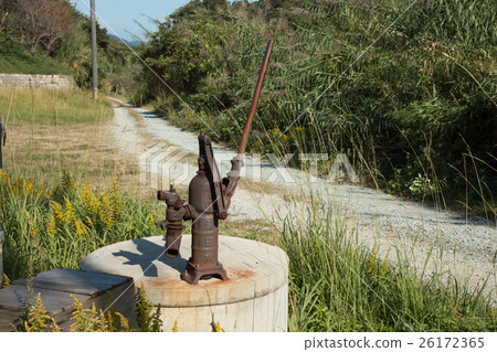 Old well and road leading to the sea 26172365