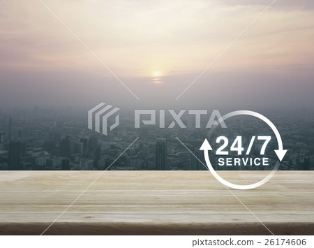 24 hours service icon on wooden table over city 24 hours service icon on wooden table over city 26174606