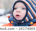 Attractive baby boy playing with the first snow 26174869