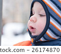 Attractive baby boy playing with the first snow 26174870
