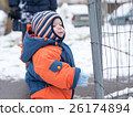 Attractive baby boy playing with the first snow 26174894