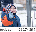 Attractive baby boy playing with the first snow 26174895