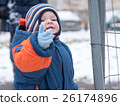 Attractive baby boy playing with the first snow 26174896