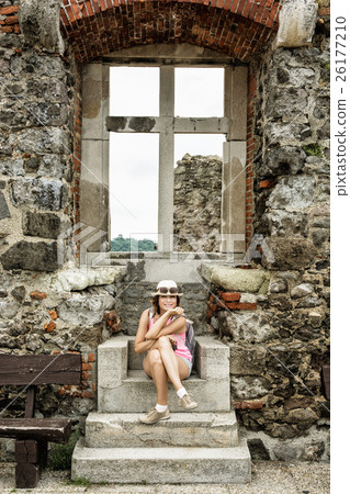 Young tourist caucasian woman posing with window Young tourist caucasian woman posing with window 26177210