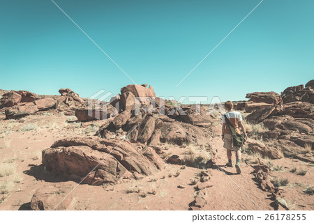 Tourist walking in the Namib desert 26178255