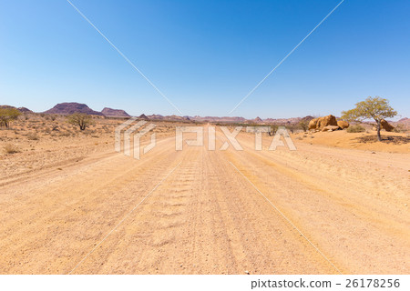 Gravel 4x4 road crossing the colorful desert 26178256