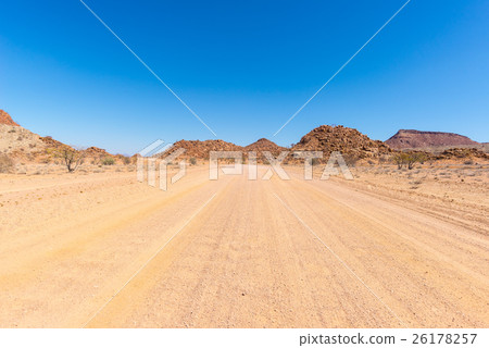 Gravel 4x4 road crossing the colorful desert 26178257