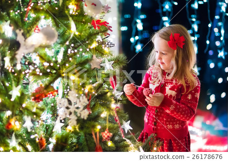 Child decorating Christmas tree Child decorating Christmas tree 26178676