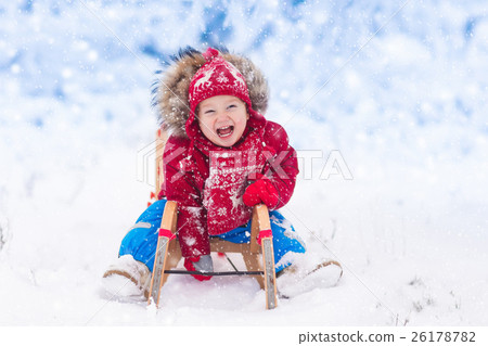 Kids play in snow. Winter sleigh ride for children 26178782