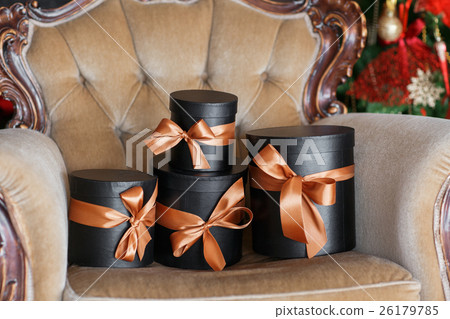 Wrapped gift black boxes with ribbons as Christmas 26179785