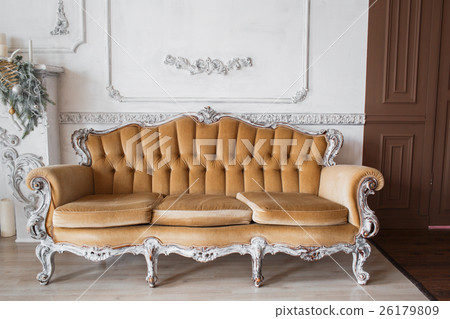 Living room with antique stylish beige sofa on 26179809