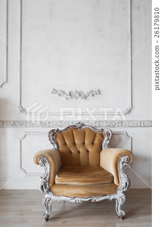 Living room with antique stylish beige armchair on 26179810