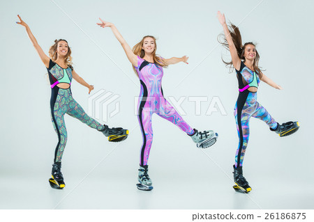 The group of girls, jumping on kangoo training The group of girls, jumping on kangoo training 26186875